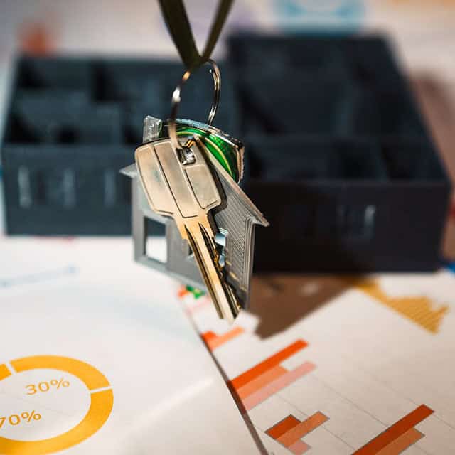 Keys and lockbox representing business security and insurance coverage solutions.