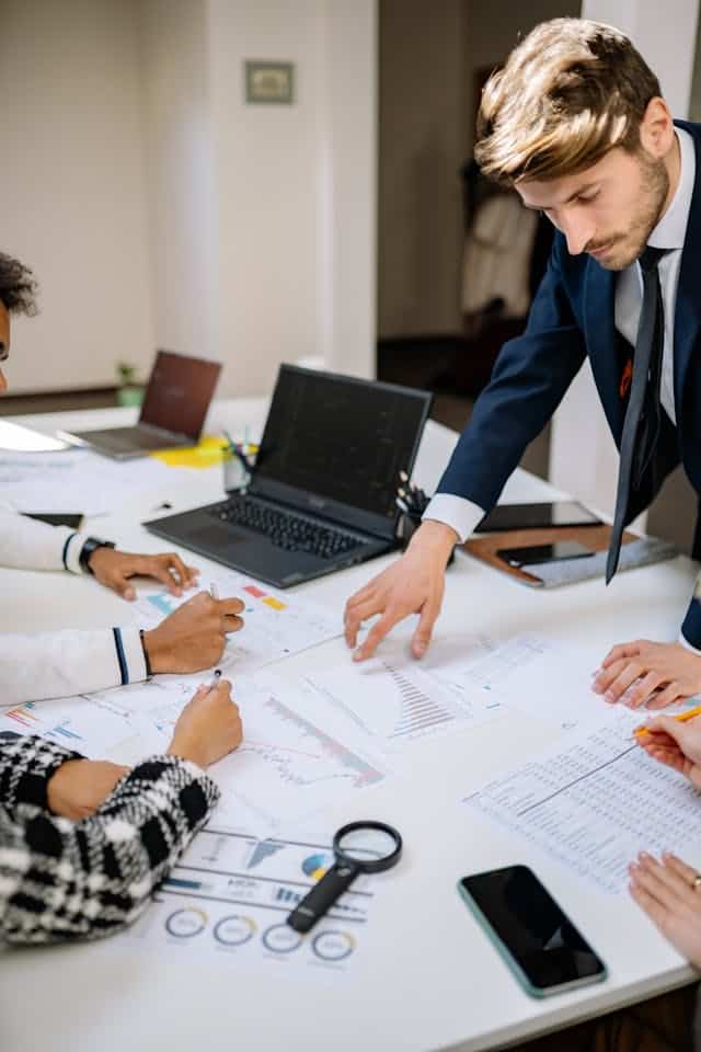 Business team discussing insurance strategies at a meeting.